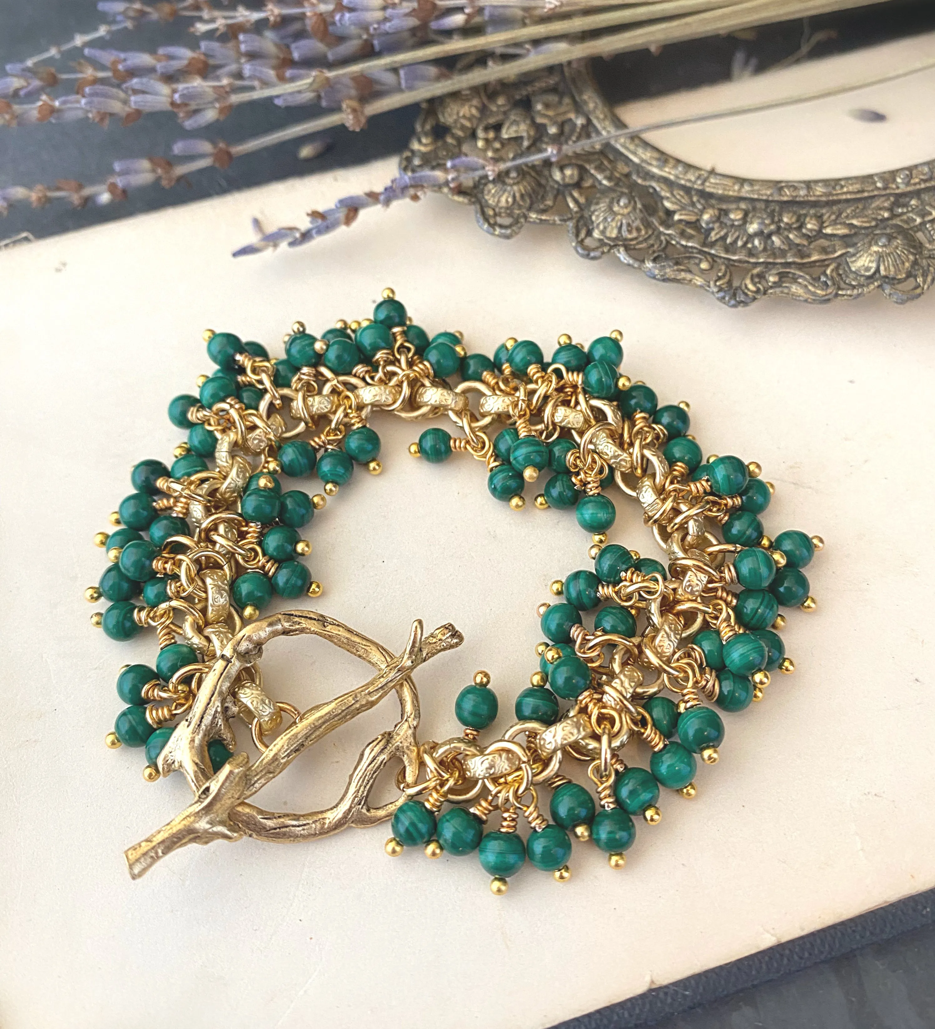 Genuine Green malachite gemstone and gold metal bracelet.