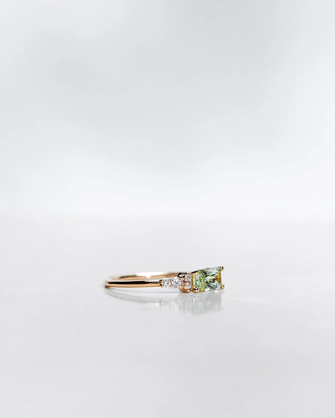 One-Of-A-Kind Cluster Ring with a Radiant-Cut Light Green Sapphire and Brilliant Diamonds (Total 0.94 CT)