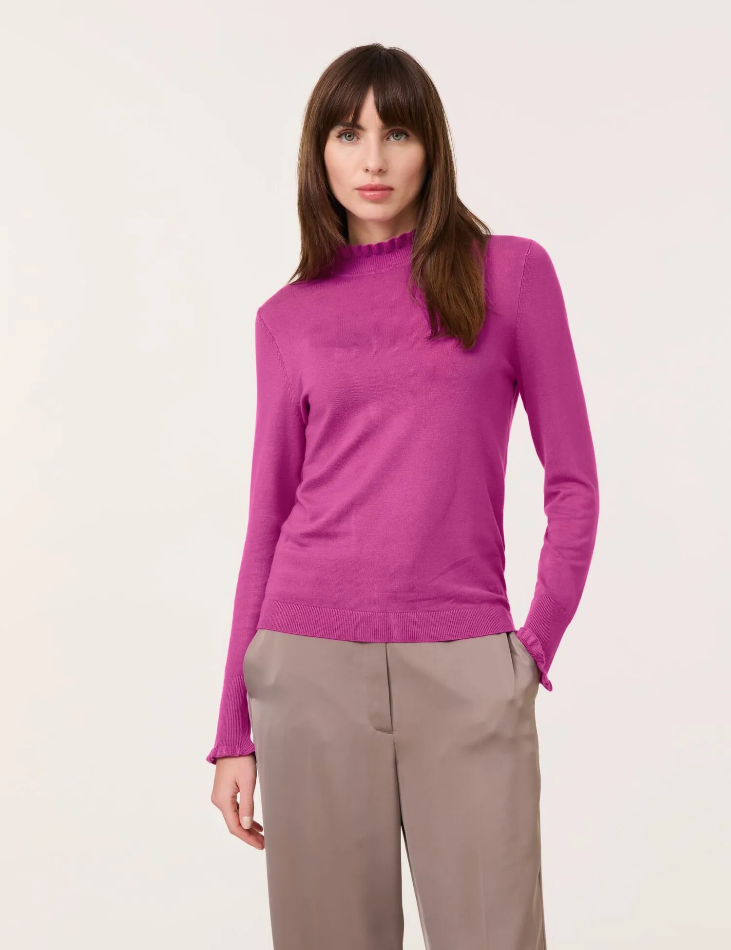 Turtleneck jumper with ruffled edges